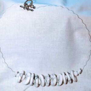 New necklace made of white stones with gray accents